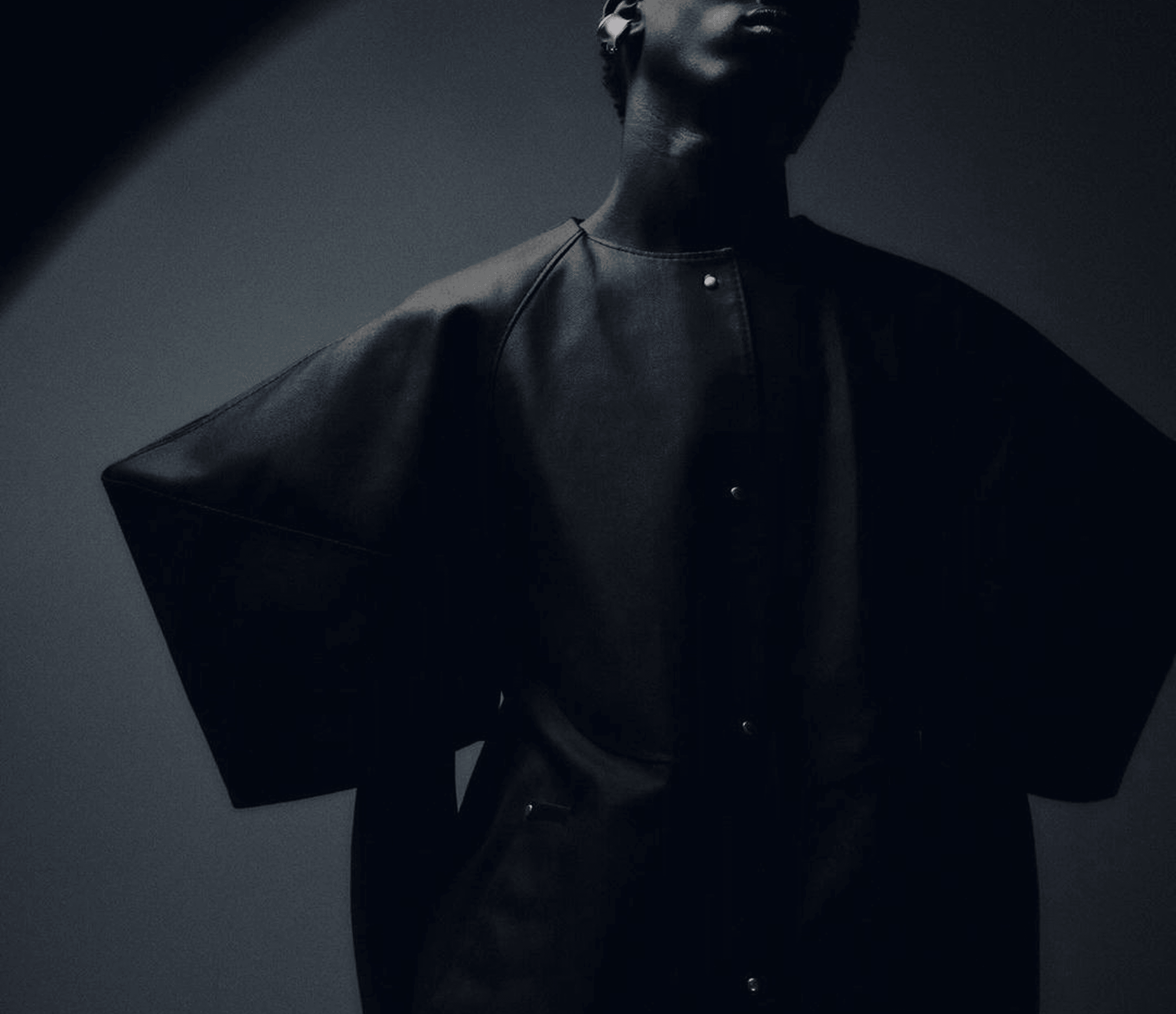 Fashion model in dark clothing